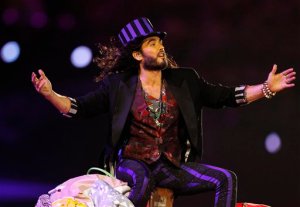 FILE - In this Sunday, Aug. 12, 2012 file photo, British actor Russell Brand performs during the Closing Ceremony at the 2012 Summer Olympics, in London. Brand doesn't vote, but he has stepped into Britain's election campaign by interviewing Labour Party leader Ed Miliband. The comedian turned anti-capitalist campaigner released the interview Wednesday, April 29, 2015 on his YouTube channel, which has more than 1 million subscribers. (AP Photo/Jae C. Hong, File)
