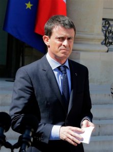 CAPTION CORRECT, CORRECTS DATE - French Prime Minister Manuel Valls addresses the media after a cabinet meeting at the Elysee Palace in Paris, France,  Wednesday, April 22, 2015. An Islamic extremist with an arsenal of heavy weapons planned an imminent attack on one or more French churches, France's top security official said Wednesday, announcing the arrest of the man who is also accused in the death of a young mother, Aurelie Chatelain, a 32-year-old Frenchwoman visiting Paris for a training session for her work. (AP Photo/Jacques Brinon)