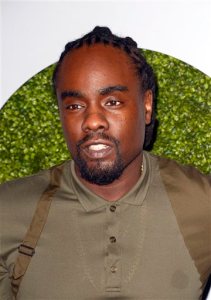 FILE - In this Dec. 4, 2014 file photo, rapper Wale attends the 2014 GQ Men of the Year Party in Los Angeles. Wale always wanted to feature Jerry Seinfeld in his music. Over the past two years, Wale and Seinfeld met often to conjure up creative ideas. Wale called their chemistry "natural" and now is eager for listeners to hear the finish product through his fourth album, "The Album About Nothing," which was released this week. (Photo by Dan Steinberg/Invision/AP, File)