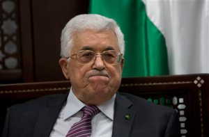 FILE - In this Wednesday, Sept. 16, 2015 file photo, Palestinian President Mahmoud Abbas makes comments to journalists on the ongoing unrest at the Al-Aqsa mosque compound in Jerusalem, in the West Bank city of Ramallah. Abbas' hopes of setting up a Palestinian state through negotiations with Israel have been derailed, and a new poll shows that a majority of Palestinians want Abbas to resign and dissolve his self-rule government, the Palestinian Authority. Many no longer believe setting up Palestine alongside Israel is realistic and support political violence. (AP Photo/Majdi Mohammed, File)