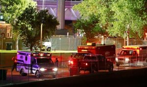 Fire units and ambulances line up to transport injured concert goers at Tempe Beach Park Saturday, Sept. 26, 2015 in Tempe, Ariz. An Arizona music festival is set to resume for a Kanye West performance after as many as 12 people were injured when a crowd rushed a stage, officials said Sunday. (David Kadlubowski/The Arizona Republic via AP)  MARICOPA COUNTY OUT; MAGS OUT; NO SALES; MANDATORY CREDIT