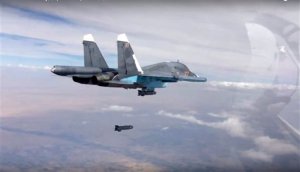 FILE - In this file photo made from the footage taken from Russian Defense Ministry official website on Friday, Oct. 9, 2015, a bomb is released from Russian Su-34 strike fighter in Syria. Hundreds of Iranian troops are being deployed in northern and central Syria, dramatically escalating Tehrans involvement in the civil war as they join allied Hezbollah fighters in an ambitious offensive to wrest key areas from rebels amid Russian airstrikes. (Russian Defense Ministry Press Service via AP, File)