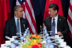 U.S. President Barack Obama, left, meets with Chinese President Xi Jinping during their meeting held on the sidelines of the COP21, United Nations Climate Change Conference, in Le Bourget, outside Paris, Monday, Nov. 30, 2015. (AP Photo/Evan Vucci)