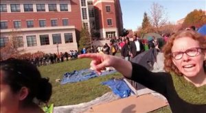 FILE - This Nov. 9, 2015 file frame grab provided by Mark Schierbecker shows Melissa Click, right, an assistant professor in the University of Missouri's communications, is seen during a run-in with student journalists during protests on the Columbia campus. Top administrators at the school on Thursday, Feb. 25, 2016, announced they had fired Click. She was suspended after being videotaped calling for "some muscle" to remove a student videographer during the protests. (Mark Schierbecker via AP, File)  MANDATORY CREDIT