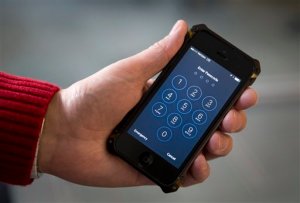 FILE - In this Feb. 17, 2016 file photo, an iPhone is seen in Washington. The FBIs announcement that it mysteriously hacked into an iPhone is a setback for Apple and increases pressure on the technology company to restore the security of its flagship product. (AP Photo/Carolyn Kaster, File)