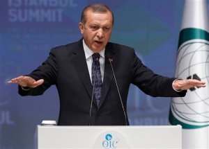 Turkey's President Recep Tayyip Erdogan speaks during a news conference at the end of 13th Organization of Islamic Cooperation, OIC, Summit in Istanbul, Friday, April 15, 2016. The two-day summit bringing together leaders of the Islamic world concluded in the Turkish city of Istanbul with a pledge to combat terrorism, cast aside sectarian differences and address regional conflicts.(AP Photo/Emrah Gurel)