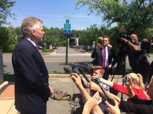 Virginia Gov. Terry McAuliffe speaks to reporters following a scheduled event at a parole and probation office in Alexandria, Va., Tuesday, May 24, 2016. McAuliffe, questioned about a federal probe of donations to his gubernatorial campaign, said he is confident he followed the law. (AP Photo/Matthew Barakat)