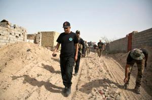 Operation commander Lt. Gen Abdel Wahab al-Saadi, center, visits the edge of the Shuhada neighborhood in Islamic State-held Fallujah, Iraq, just before special forces pushed into the district Wednesday, June 8, 2016. The operation to retake Fallujah is expected to be one of the most difficult yet." This city in Iraq's western Anbar province is symbolically important to the militant group and has been a bastion of support for anti-government militants since the 2003 U.S.-led invasion of Iraq. (AP Photo/Maya Alleruzzo)