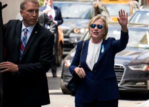 Democratic presidential candidate Hillary Clinton walks from her daughter's apartment building Sunday, Sept. 11, 2016, in New York. Clinton unexpectedly left Sunday's 9/11 anniversary ceremony in New York after feeling "overheated," according to her campaign. (AP Photo/Craig Ruttle)