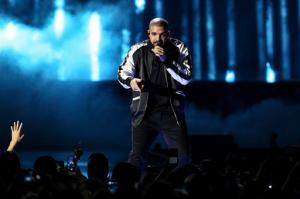 FILE - In this Friday, Sept. 23, 2016, file photo, Drake performs at the 2016 iHeartRadio Music Festival - Day 1 at T-Mobile Arena in Las Vegas. Drake earned a record-breaking 13 American Music Awards nominations on Monday, Oct. 10, thanks to his latest album "Views," shattering Michael Jackson's mark of 11 nominations in a single year from 1984. (Photo by John Salangsang/Invision/AP, File)