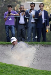 England's Lee Westwood hits the ball out of a bunker on the 9th hole, in round one of the Mexico Championship at the Chapultepec Golf Club in Mexico City, Thursday, March 2, 2017. All but one of the world's top 50 golfers are contesting the World Golf Championship PGA event, which this year relocated to Mexico City from the Trump National Doral Resort in Florida. (AP Photo/Rebecca Blackwell)